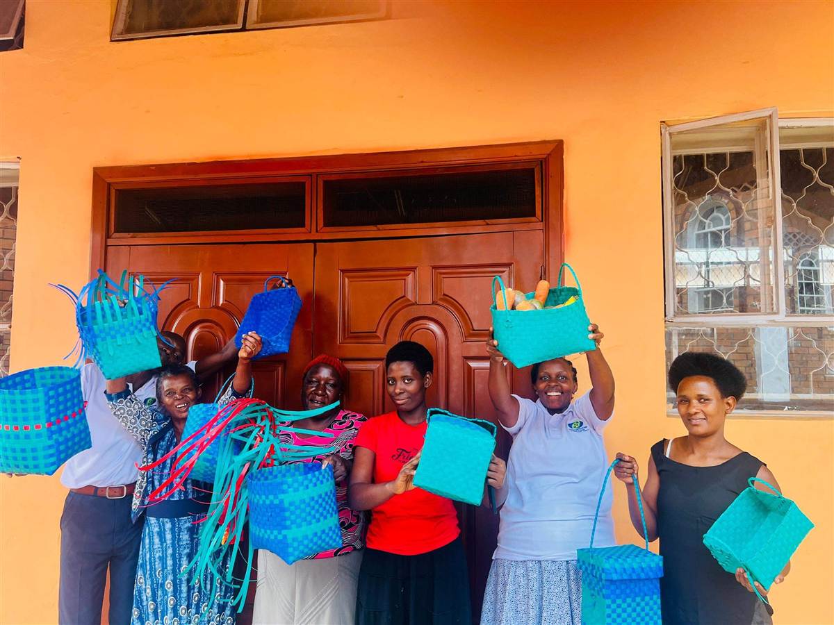 Community proudly showing finished baskets